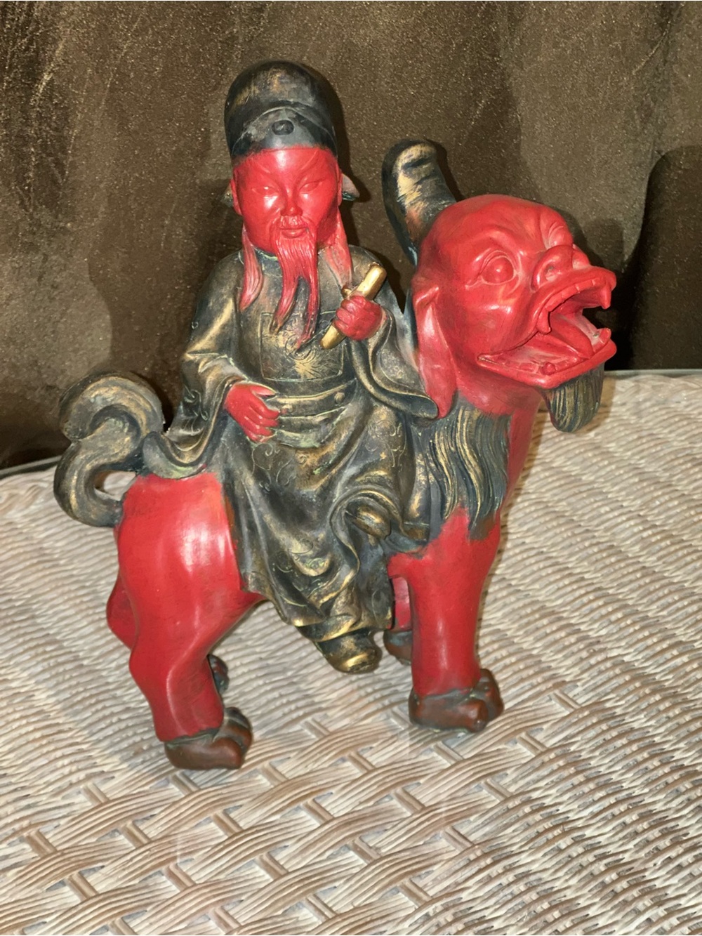 MANN Chinese Red Man Riding Foo Dog Statue